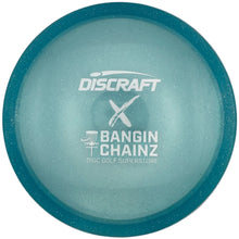 A Discraft Bangin' Chainsz disc golf disc in translucent light blue with a teal rim, shown inside its white retail packaging.