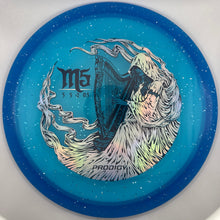 A disc golf disc, specifically a Proco Gy M5 3326, featuring a blue and teal gradient background with white speckles, a central harp illustration, and the text 'M5' and 'PROCOGY'.