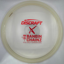 A translucent off-white Discraft Bangin' Chainz disc golf disc with red printed logos, shown inside its white protective packaging.