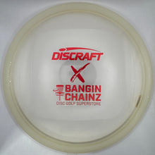 A translucent white disc golf disc with red printed branding, including 'DISCRAFT' and 'BANGIN' CHAINZ', resting on a white foam insert.