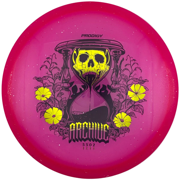 A bright pink Prodigy Arch Hound disc golf disc with a yellow skull hourglass graphic and yellow flowers, displayed inside a white box.