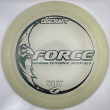 A Discraft Force disc golf disc in translucent off-white plastic with black and gray printed graphics, shown inside its white retail packaging.