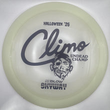 A translucent pale yellow-green disc golf disc with black printed graphics, including the name 'Climo' and 'Halloween '25', shown inside a white sleeve or box.