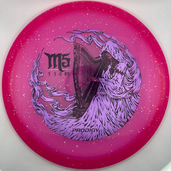 A pink disc golf disc with a purple harpy graphic and the text 'M5' and 'PRODIGY' on a white background.