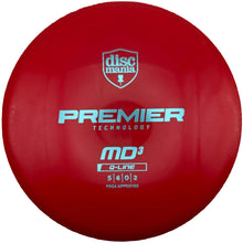 A red Discmania Premier Technology MD3 online disc golf disc, shown from the front with white and silver branding, resting on a white surface.