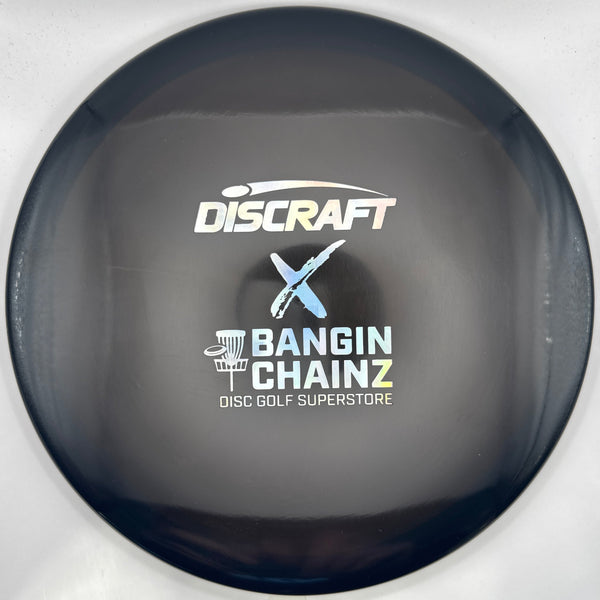 A close-up of a Discraft disc golf disc with a black outer rim and a purple inner face, featuring the white and blue Discraft and Bangin' Chainz logos printed on the center.