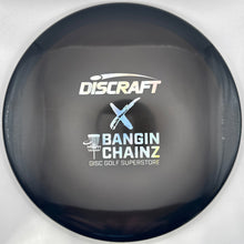 A close-up of a Discraft disc golf disc with a black outer rim and a purple inner face, featuring the white and blue Discraft and Bangin' Chainz logos printed on the center.