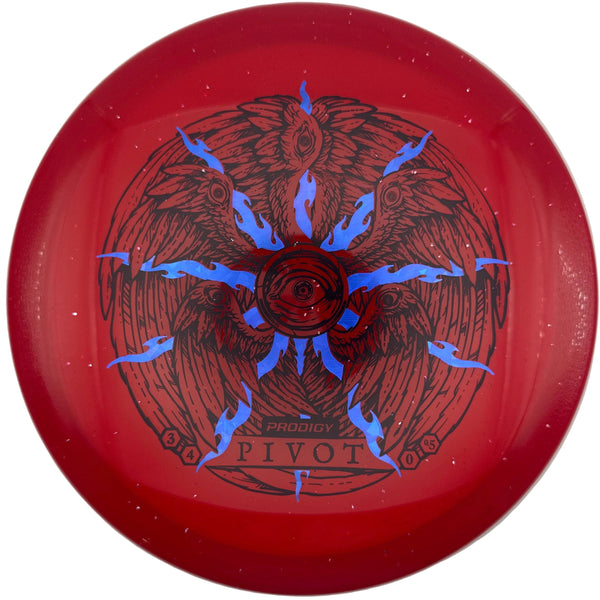 A red disc golf disc with a blue and black winged sunburst design, labeled 'Pivotal' and 'Flight Path', resting on a white surface.