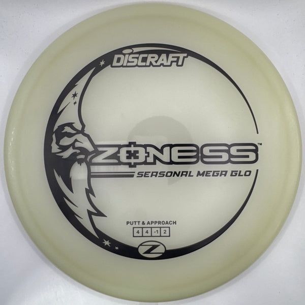 A translucent off-white Discraft Z-Ness personal medallion disc golf disc resting on a white foam insert, with black printed graphics and branding.