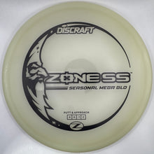 A translucent off-white Discraft Z-Ness personal medallion disc golf disc resting on a white foam insert, with black printed graphics and branding.