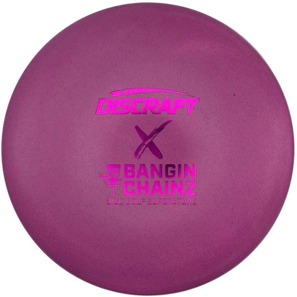 A purple Discraft Born to Chain Z disc golf disc resting inside its white foam packaging insert.