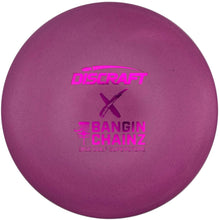 A purple Discraft Born to Chain Z disc golf disc resting inside its white foam packaging insert.