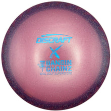 A Discraft X The Bangin' Chainz golf disc in a pink and purple gradient finish with blue foil stamping, resting on a white surface.
