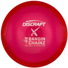 A pink Discraft Bangin' Chainz disc golf disc with white printed logos, shown inside its white packaging insert.