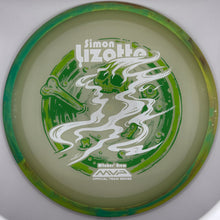 A disc golf disc featuring a green and white 'Simon Lizotte' design, photographed through a circular white frame or lens.