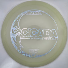 A translucent pale yellow-green disc golf disc with a white graphic design reading 'CICADA' and 'SURVIVAL NEON GOLD', shown inside its white packaging sleeve.