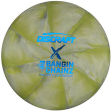 A translucent pale yellow disc golf disc with blue 'DISCRAFT x BANGIN' CHAINZ' logos, photographed inside a white box.
