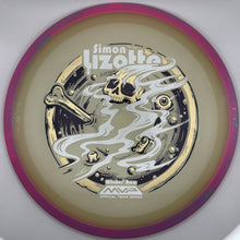 A disc golf disc from the MVP Disc Sports Simon Lizotte 'Blister' Series, featuring a metallic gold and silver skull graphic with smoke swirls on a beige background, surrounded by a pinkish-purple rim.