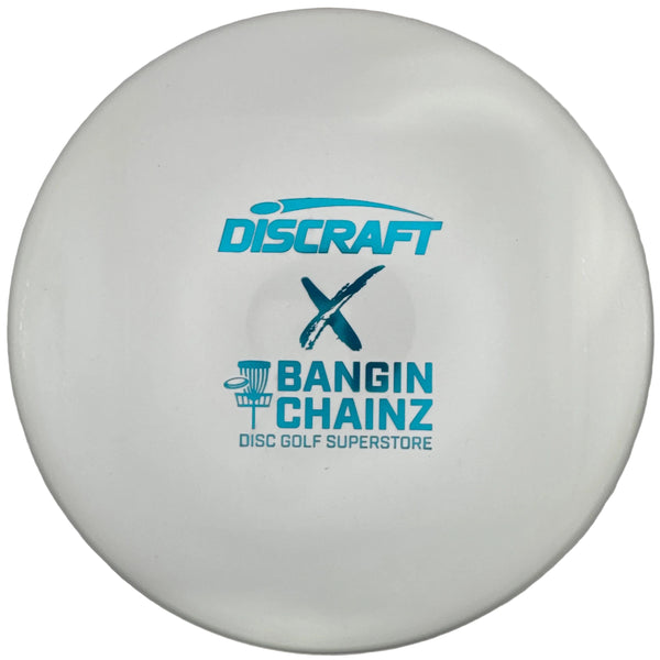 A white Discraft x Bangin' Chainz disc golf disc with blue logos, displayed inside its gray packaging sleeve.