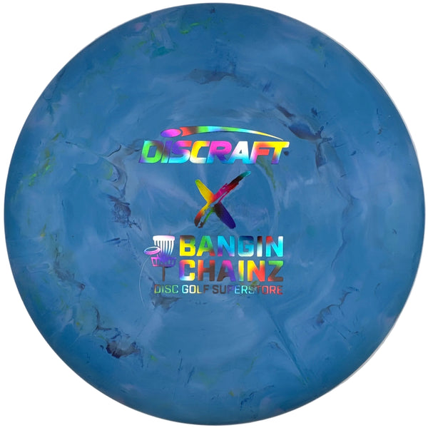 A blue Discraft Bandin' Chainz disc golf supermarble disc resting inside its white cardboard packaging.