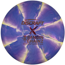 A Discraft BANGIN' CHAINZ disc golf superbolt disc with a purple and blue marbled pattern and yellow highlights, shown inside its white protective sleeve.