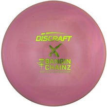 A pink Discraft X Bangin' Chainz disc golf disc with neon green foil stamping, displayed inside its white packaging box.