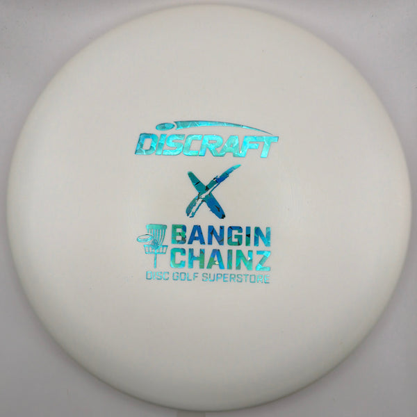 A white Discraft x Bangin' Chainz disc golf disc with holographic blue foil stamping, resting on a white surface.
