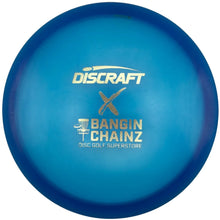 A blue Discraft disc golf disc with gold foil stamping that reads 'Discraft x Bangin Chainz Disc Golf Superstore', resting on a white surface.