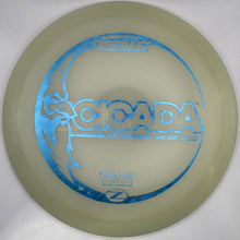 A disc golf disc with a translucent pale yellow-green body and a blue foil stamp reading 'SCOPADY' and 'MERCURY Z', shown inside its white retail box.