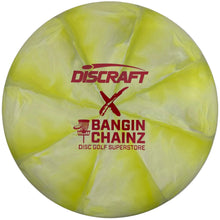 A yellow-green Discraft x Bangin' Chainz disc golf super one disc with red printed logos, shown inside its white packaging sleeve.