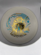 A disc golf disc featuring a cream-colored plastic body with a metallic gold and light blue foil stamp of a wolf holding a bow, with the text 'FLIJJA BIGKEL' and 'KRAKENHUNT'.