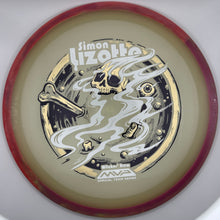 A disc golf disc featuring a custom printed graphic of a skull, bone, and smoke swirls, with the text 'Simon Lizotte' and 'MVP Winter Storm'. The disc has a translucent amber-tinted center, a dark red outer rim, and a white outer background.