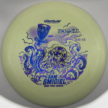 A pale yellow-green Gateway Sam Smiguel disc golf disc with blue and purple graphic artwork of an octopus and a trophy cup, shown on a neutral gray background.