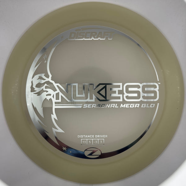 A close-up of a disc golf disc on a white background, featuring the 'Nukess' model name and 'Distance Driver' text.