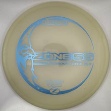 A disc golf disc, specifically a Zoness SS-100 Midrange 2.0, resting on its white foam insert.