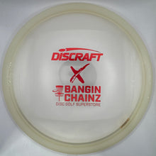 A translucent off-white Discraft X Bangin' Chainz disc golf disc resting on a white insert card, with red printed branding.