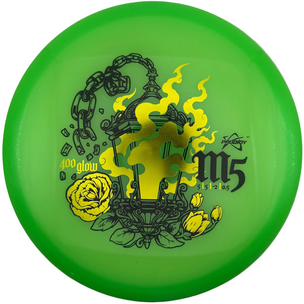 A bright green disc golf disc with a yellow and black gothic lantern graphic, featuring the text '400 glow' and 'm5 2025'.