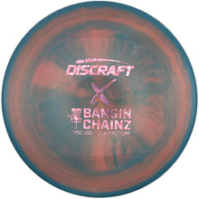 A Discraft Bangin' Chainz disc golf disc with a marbled orange, blue, and purple finish, displayed on its white cardboard packaging insert.