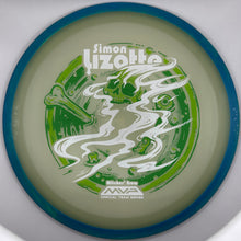 A disc golf disc featuring a green and white illustrated design with the name 'Simon Lizotte' and 'MWA Official Team Discs' printed on it, set against a silver-gray circular background.
