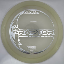 A Discraft Raptor Series 2 Metal God disc golf disc in a translucent pale yellow-green color, resting on its white foam insert packaging.