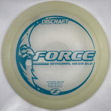 A translucent pale yellow Discraft Force distance driver golf disc with blue printed graphics, resting on a white foam insert.