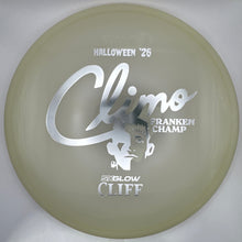 A translucent pale yellow-green disc golf disc with silver foil stamping, shown inside its white presentation box. The stamping features the text 'Climax', 'Halloween '26', 'Strancken Champ', and 'Sixlow Cliff'.