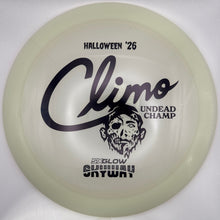 A translucent off-white disc golf disc with black printed graphics and text, including 'HALLOWEEN '26', 'Climo', 'UNDEAD CHAMP', and 'SKYWAY'. The disc is photographed inside a white sleeve or box.