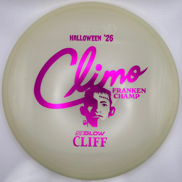 A translucent pale yellow disc golf disc with bright magenta/purple printed graphics, including the text 'Climo' and 'Halloween '26', photographed on a white background with a purple strip at the right edge.