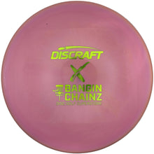 A pink Discraft Bandin Chainz disc golf disc with lime green branding, shown inside its white protective packaging sleeve.