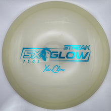 A disc golf disc, specifically a Streak Glow 7.5x60mm, shown inside its white foam packaging insert.