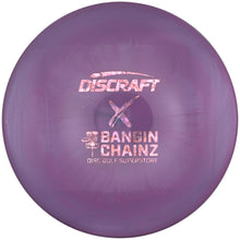 A purple Discraft Bangin' Chainz disc golf disc resting on a white foam insert.