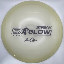 A translucent pale yellow disc golf disc with black printed graphics, including the 'Streak Glow' model name and 'Ken Clame' signature, resting on a white foam insert.