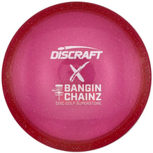 A pink Discraft disc golf disc with white printed branding and model text, shown inside a white sleeve or box.