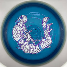 A blue disc golf disc with a white and purple mummy design, photographed from directly above inside a white circular holder.